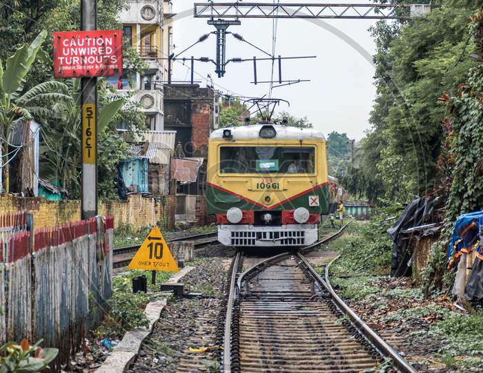 City Local Train Of The Indian Railways Moving With Passengers Within The City. Kolkata, India On August 2019