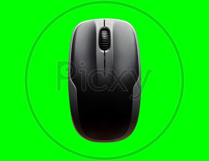 Computer Mouse Isolated On The Green Background. Above View Of Computer Mouse On Green Background. Black And Grey Computer Mouse