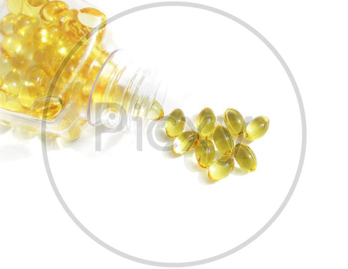 Cod liver oil  or fish oil gel capsules  on white background. It contains omega 3 fatty acids , EPA,  DHA