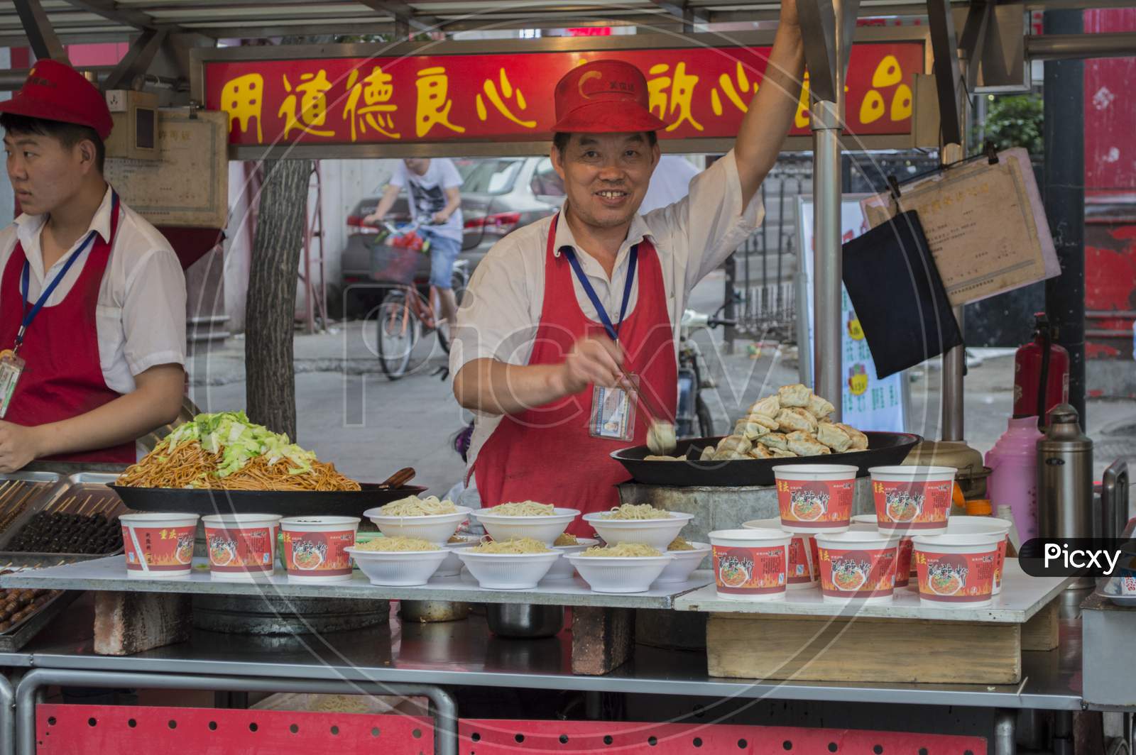 Vendors Selling Street Food In Wangfujing Street In Downtown Beijing, China