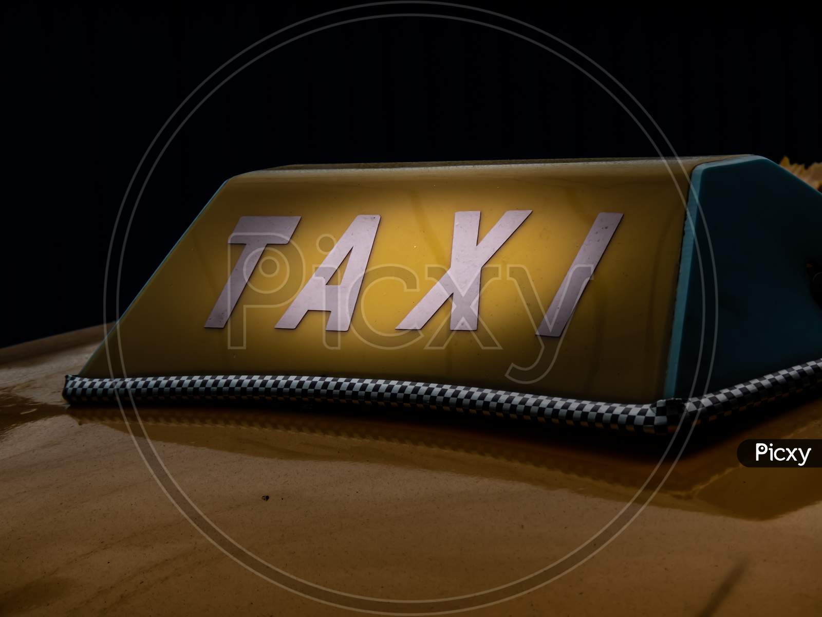 A Close Up Sign Of Taxi On The Yellow Car Famous In Kolkata.