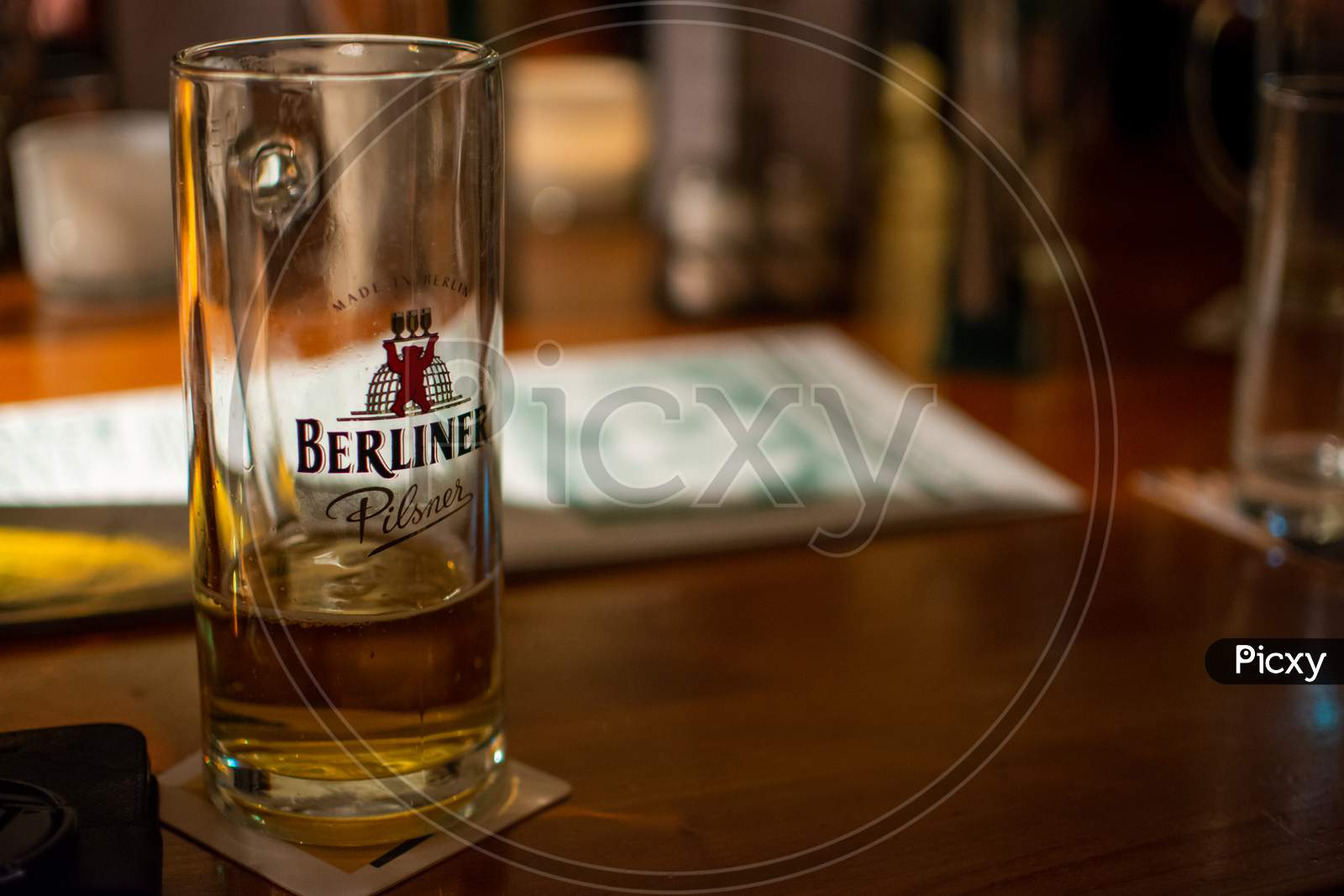 Glass Of Berliner Pilsner Beer Served In A Bar In Berlin, Germany