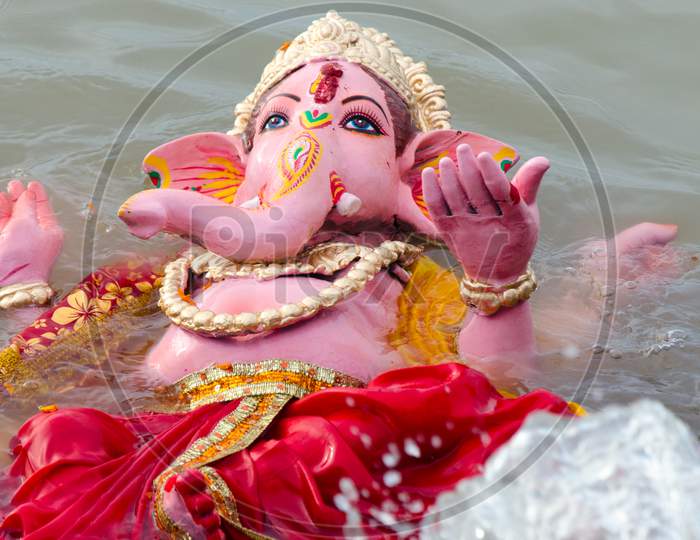 Immersion of Lord Ganesha idol in water