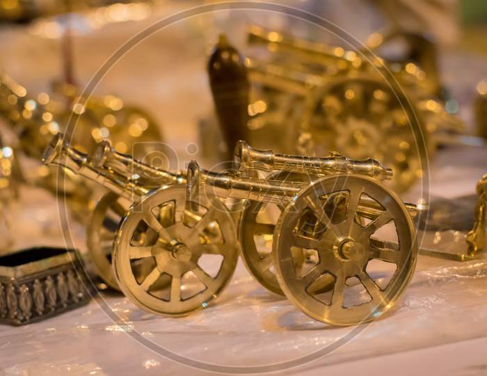 Golden Metal Canon Antique Isolated On Blurred Background
