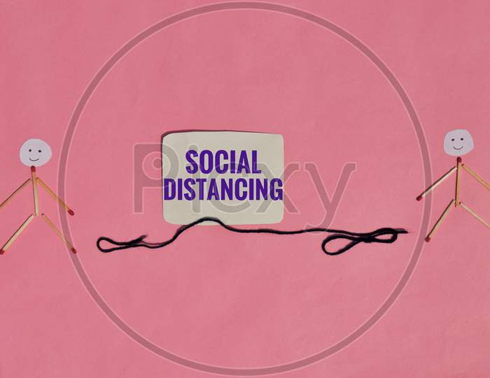 Social Distancing Or Safe Distance Conceptual Photo With Match Stick Made Characters
