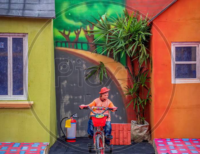 A Creation Inspired By Gulliver'S Travels By Jonathan Swift.Funny Picture Of A Lilliput Toys Toy Is Cycling In Street On October 2019 In Kolkata, India
