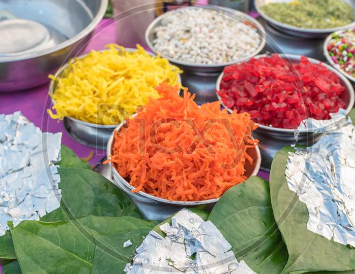 Different Types Of Colorful Garnish Pan Masala Used To Decorate Betel Leaf Banarasi Paan With Selective Focus