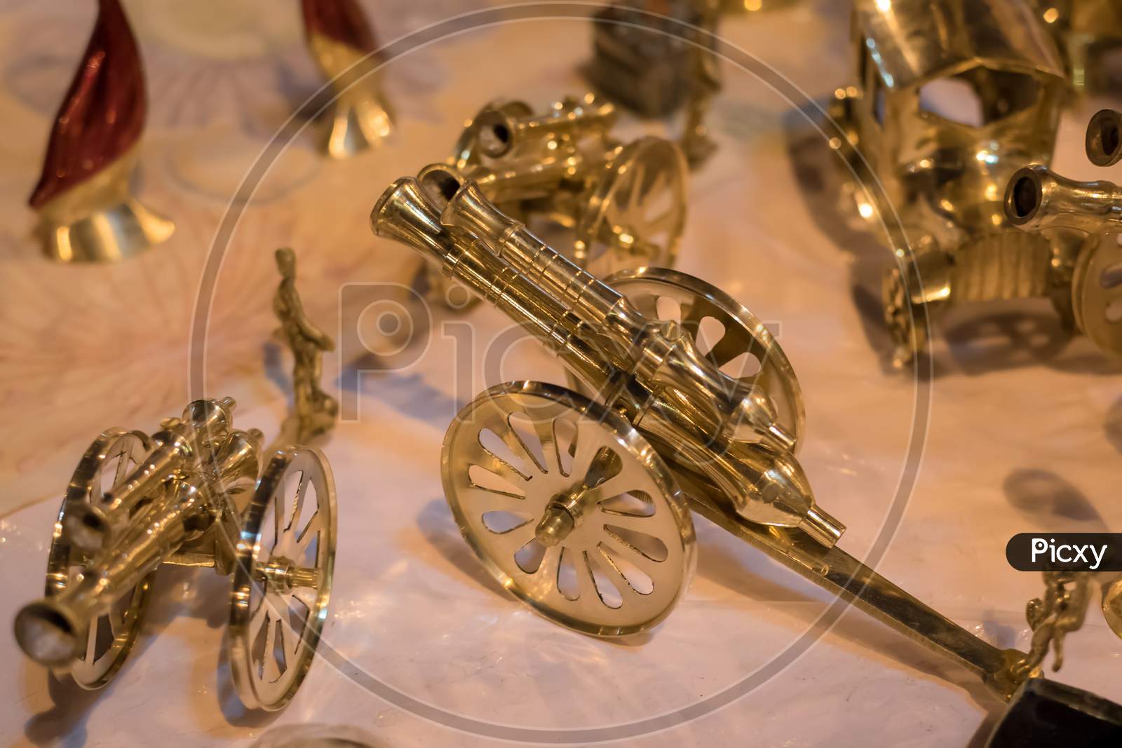 Golden Metal Canon Antique Isolated On Blurred Background