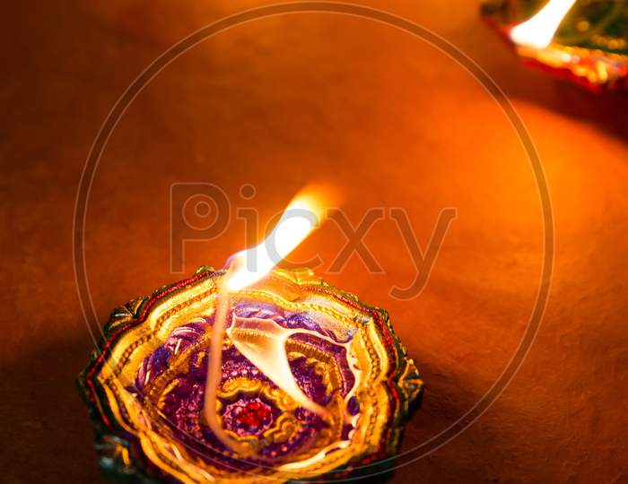 Indian cultural festival diya with a beautiful orange flame