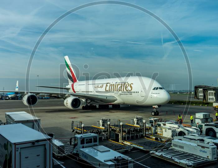 Schiphol, Amsterdam, Netherlands - 4 November 2018 : Emirates Airbus A380 Planes Waiting At The Airport Dock