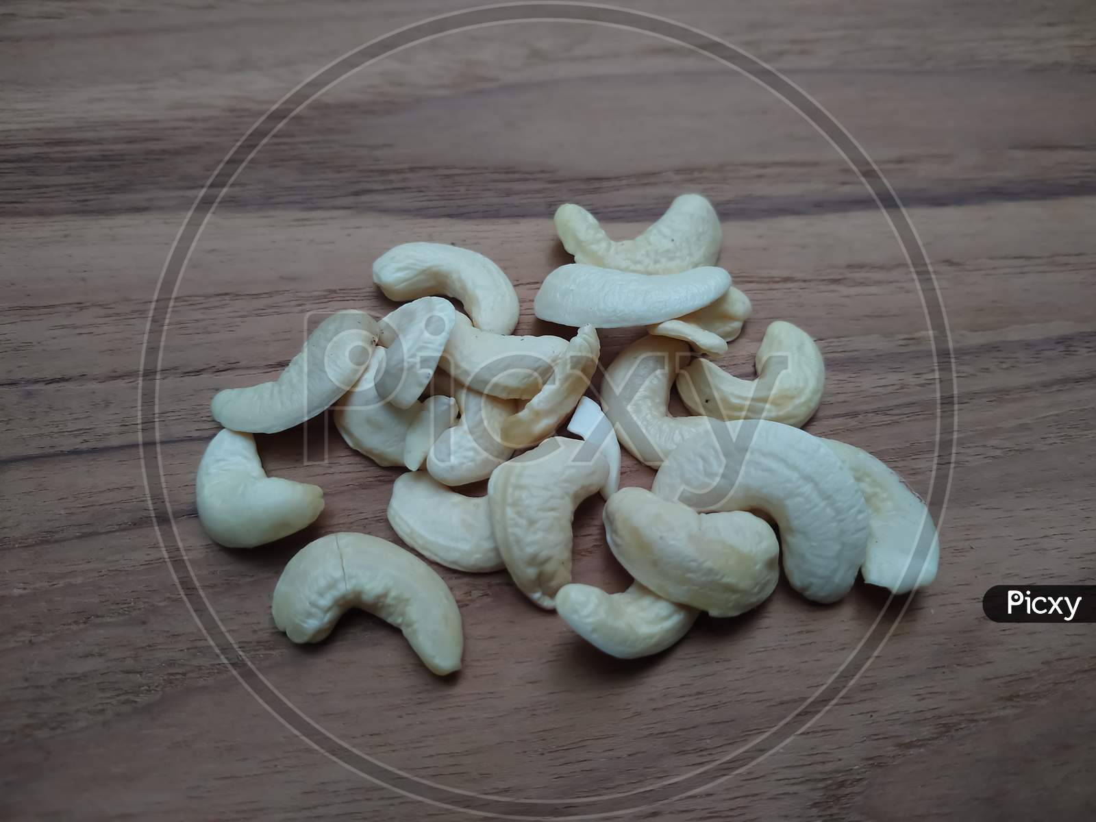 Cashew nuts on wooden background
