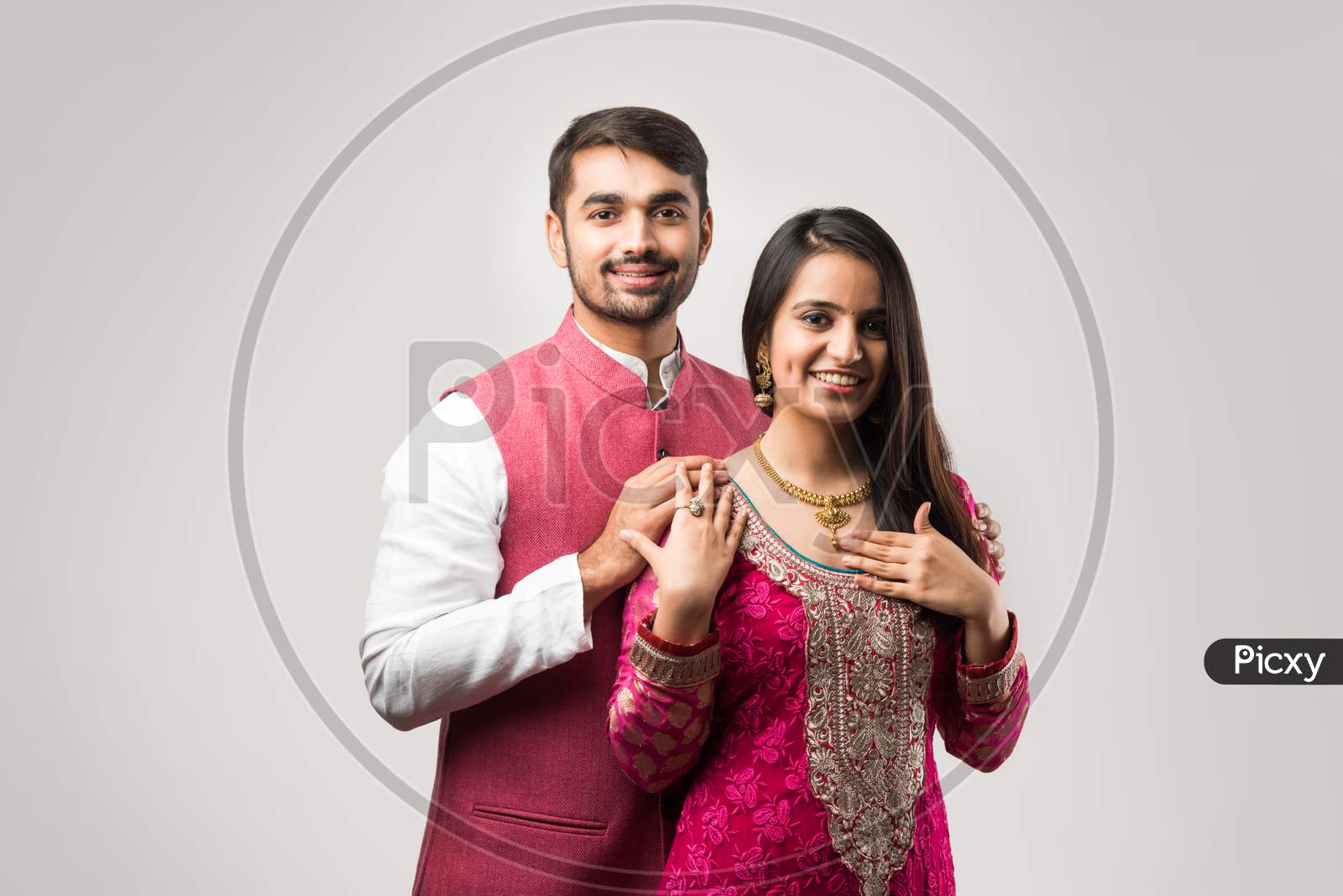 Handsome Young Indian Man Presenting Expensive Gold Necklace To Pretty Young Girl Friend Or Wife
