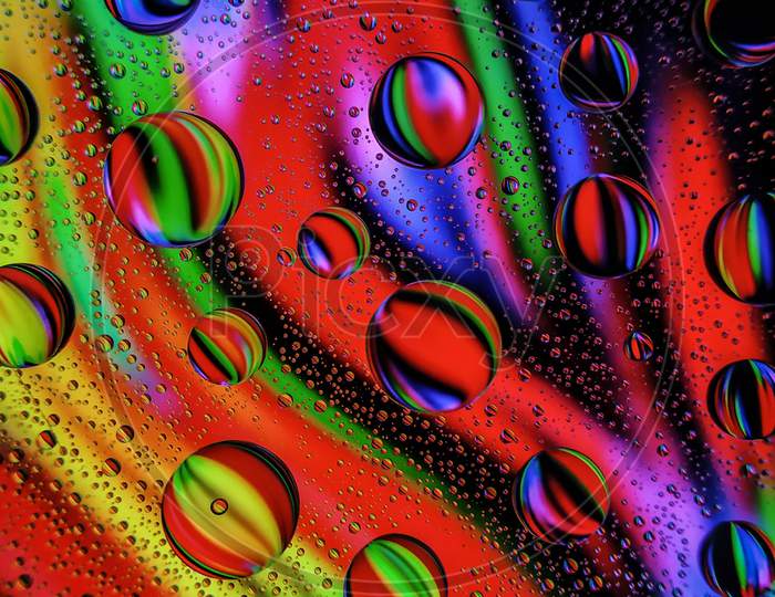 Water drops on colorful glass surface