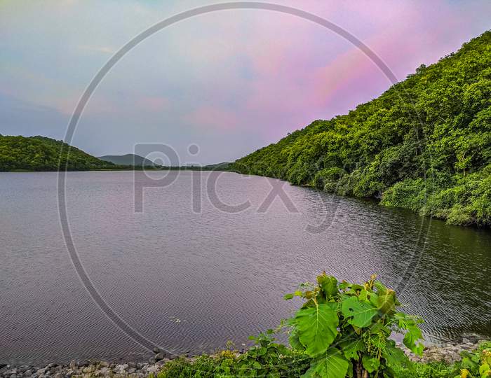 Lake, mountain with pink sky