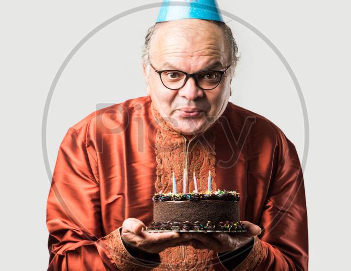 Image of An Old Man With a Birthday Cake-WP822746-Picxy