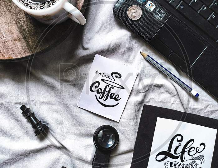 Working table with coffee and accessories with quotes, flatlay photography