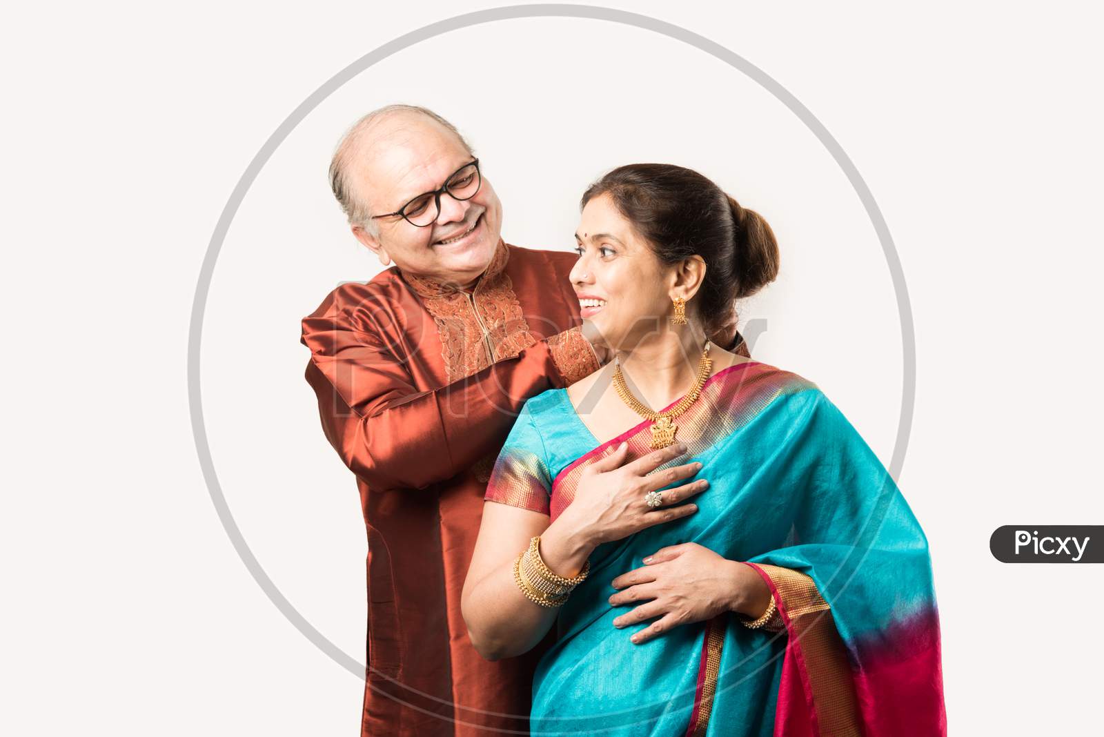 Handsome Retired Indian Man Presenting Expensive Gold Necklace To Pretty Wife