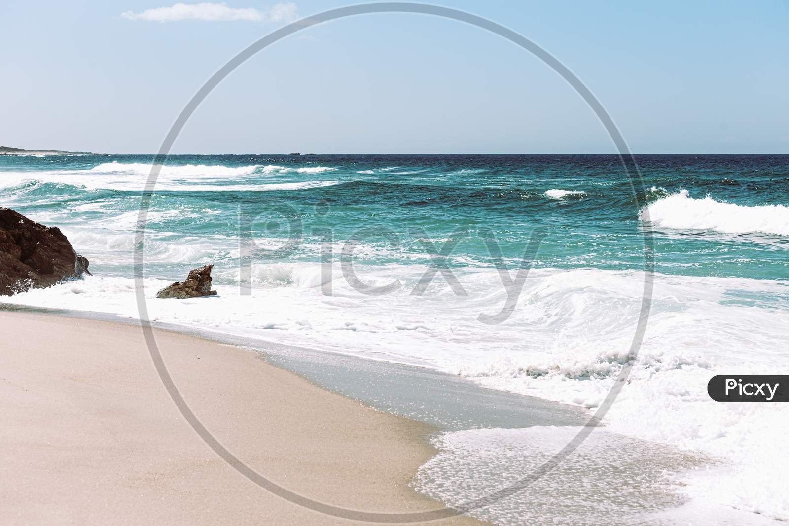 Bright And Relaxing Image Of A Wild Beach During A Sunny Day