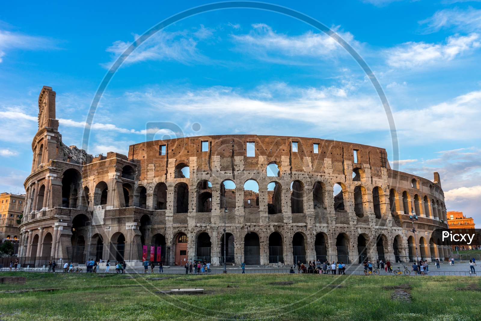 Rome, Italy - 24 June 2018: Golden Sunset At The Great Roman Colosseum (Coliseum, Colosseo), Also Known As The Flavian Amphitheatre. Famous World Landmark. Scenic Urban Landscape.