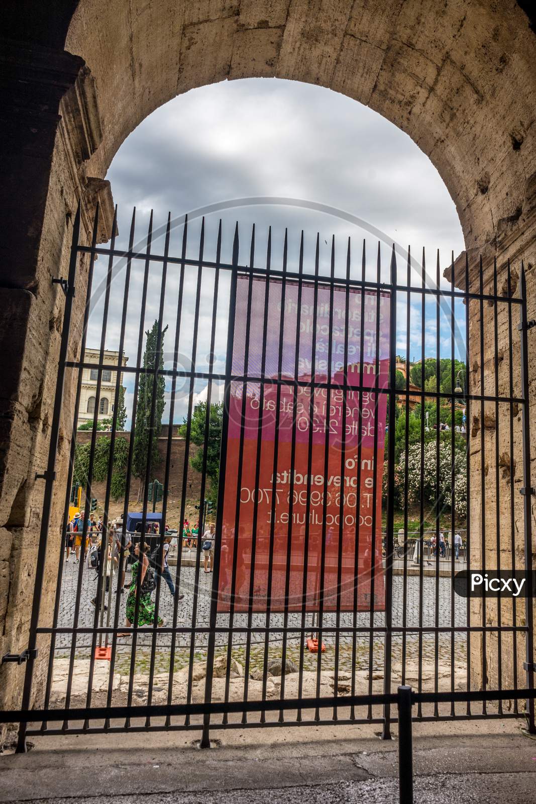 Rome, Italy - 23 June 2018: The Gated Arch Of The Passage At The Entrance Of The Roman Colosseum (Coliseum, Colosseo), Also Known As The Flavian Amphitheatre. Famous World Landmark. Scenic Urban Landscape.