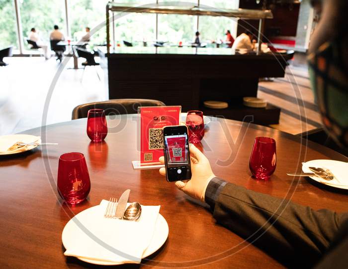 A person scans QR code for food & beverage menu installed for no-contact  at Le Meridien Hotel ahead of its reopening during Unlock 4.0 on August 31, 2020 in New Delhi, India.