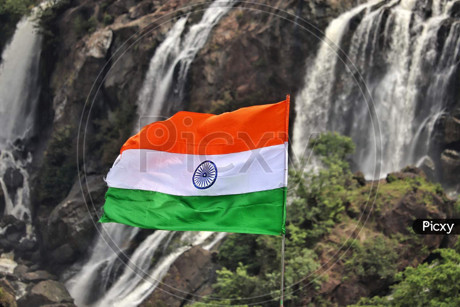 Indian flag with beautiful waterfalls in the background