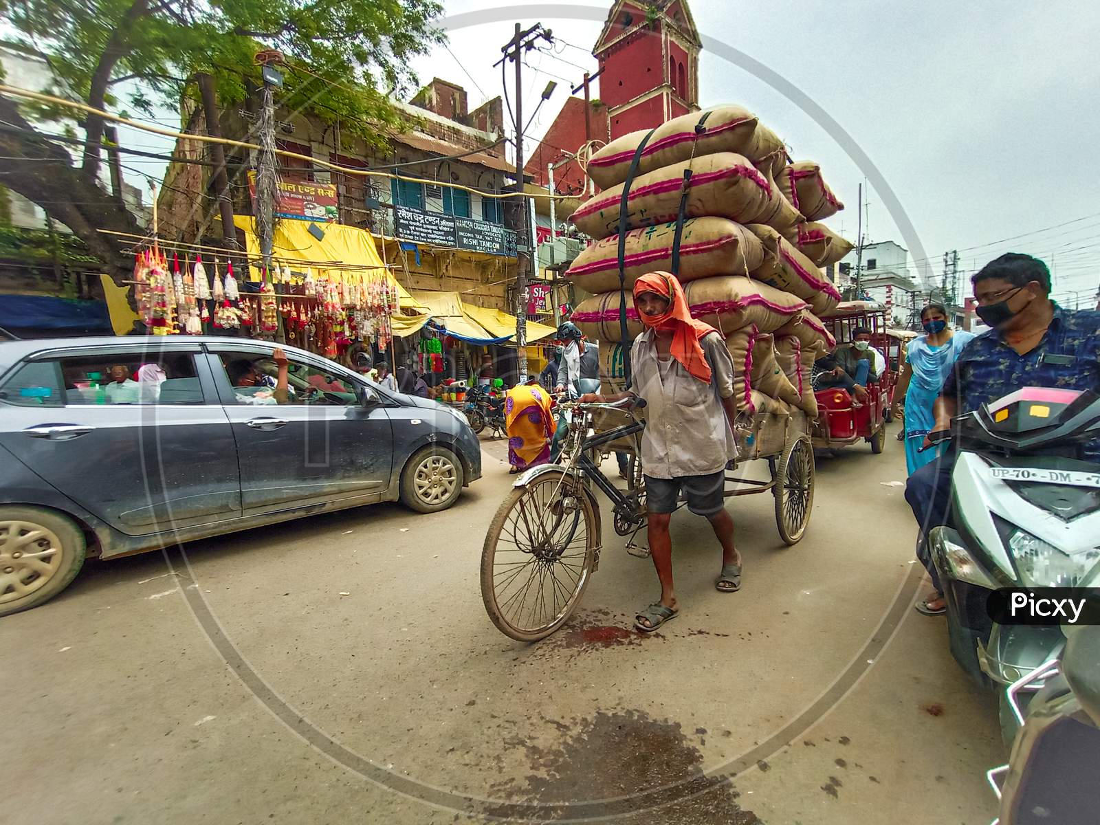 Hard working rickshaw in street