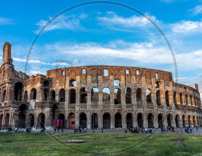 Rome, Italy - 24 June 2018: Golden Sunset At The Great Roman Colosseum (Coliseum, Colosseo), Also Known As The Flavian Amphitheatre. Famous World Landmark. Scenic Urban Landscape.