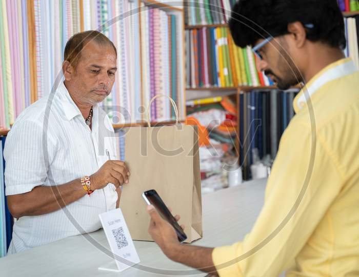 Customer Using Digital Payment Method Scan To Pay At Cloth Store To Send Money - Concept Of Digital Or Contactless Payment, E-Transfer, Technology And Lifestyle.