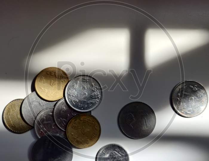 Plate of coins spread