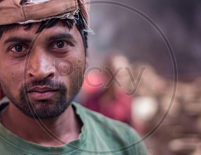 a worker with emotion on his face