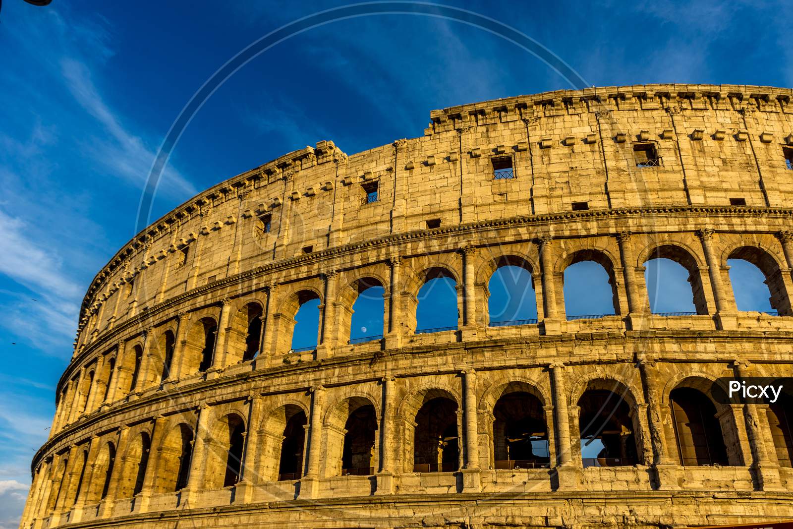 Golden Sunset At The Great Roman Colosseum (Coliseum, Colosseo), Also Known As The Flavian Amphitheatre. Famous World Landmark. Scenic Urban Landscape.