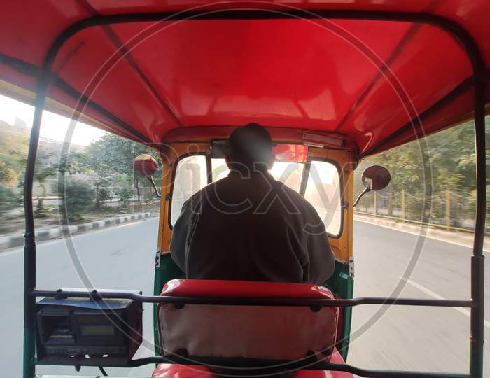 rare view Close up shot of indian auto rickshaw or rickshaw driver or tuktuk driver
