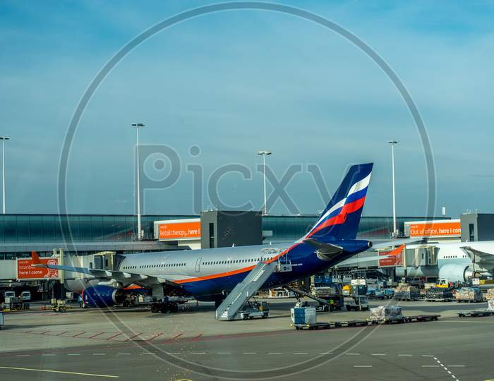 Schiphol, Amsterdam, Netherlands - 4 November 2018 : Aeroflot Planes Waiting At The Airport Dock With Ing Bank Sponsor Advertisements