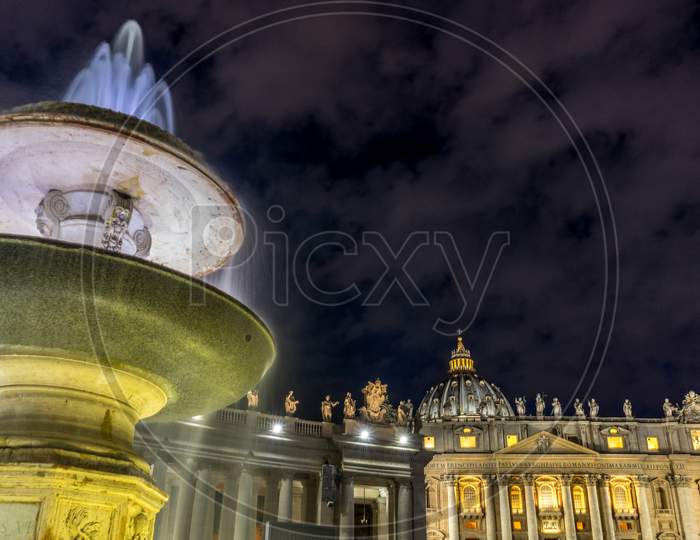 Vatican City,Italy - 23 June 2018: The Water Fountain Is Lit Up At St.Peters Square In Vatican City