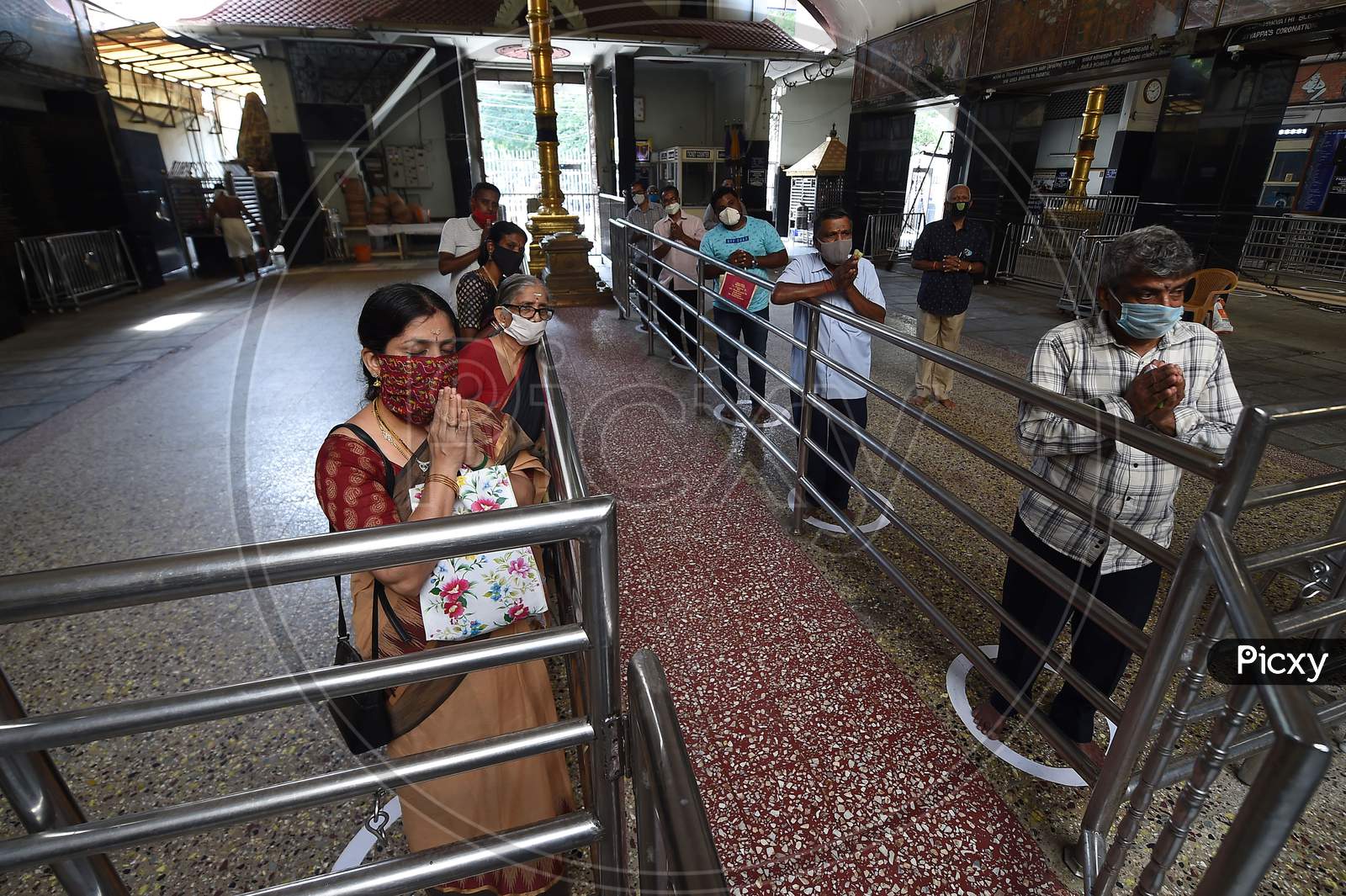 Devotees Queue Maintaining Social Distancing At A Temple As The Government Eased A Nationwide Lockdown Imposed As A Preventive Measure Against The Covid-19 Coronavirus, In Chennai On September 1, 2020.