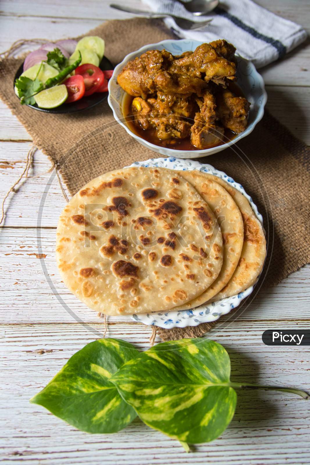 Paratha meaning an Indian style of bread made with flour
