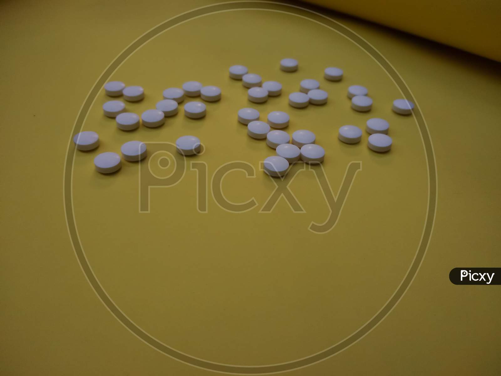 Medicinal Tablets on yellow background