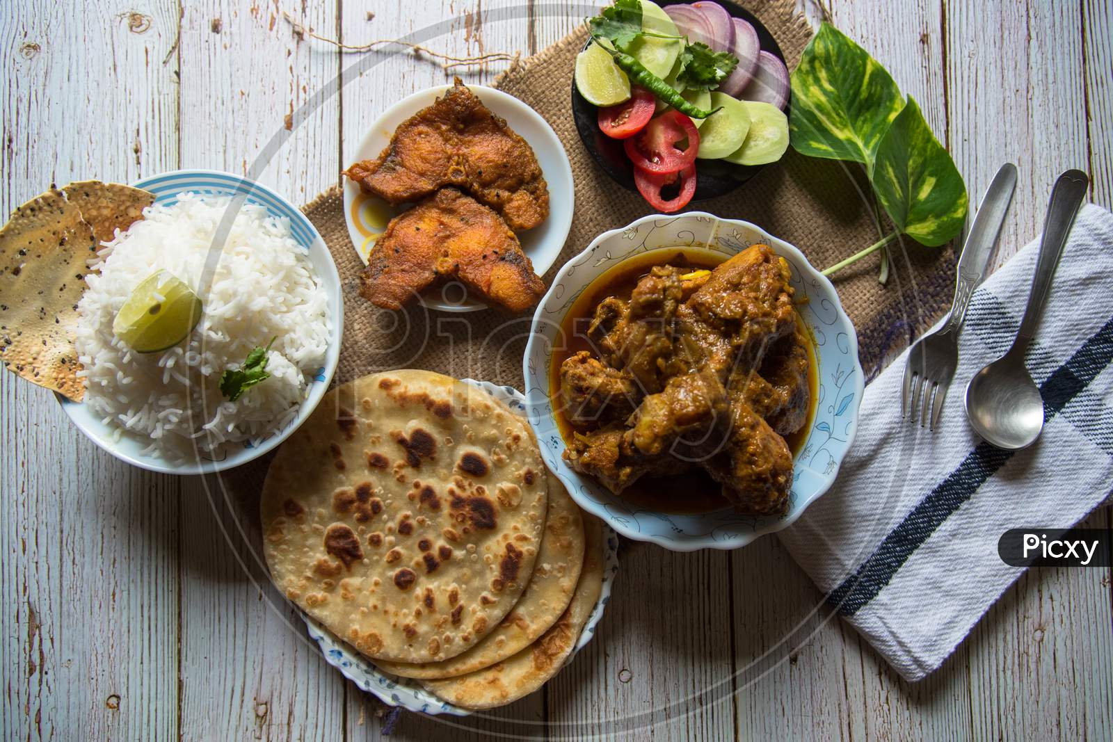 Top view of full Indian meal on a background