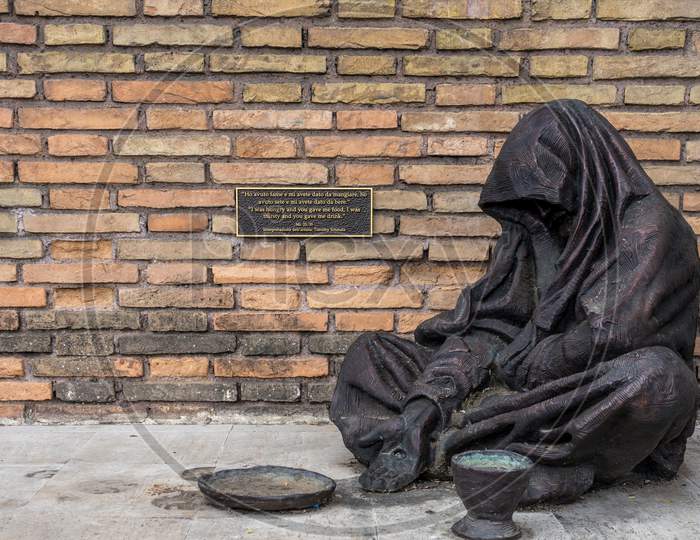 Rome, Italy - 23 June 2018: The Bronze Statue Of The Homeless Jesus By Sculptor Timothy Schmalz In Rome, Italy