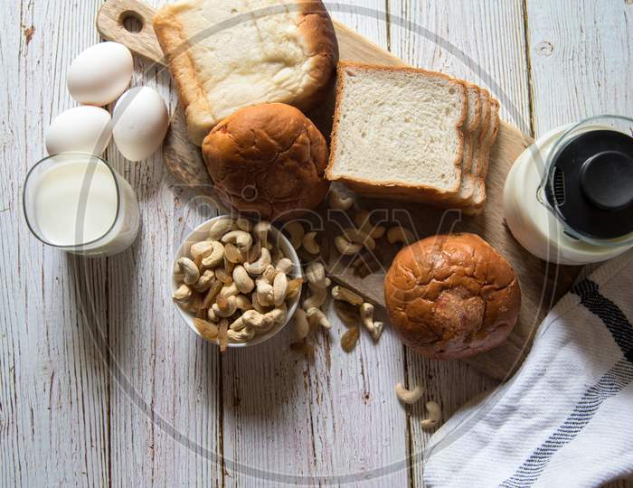 Bread, milk, egg and other food ingredients on a background