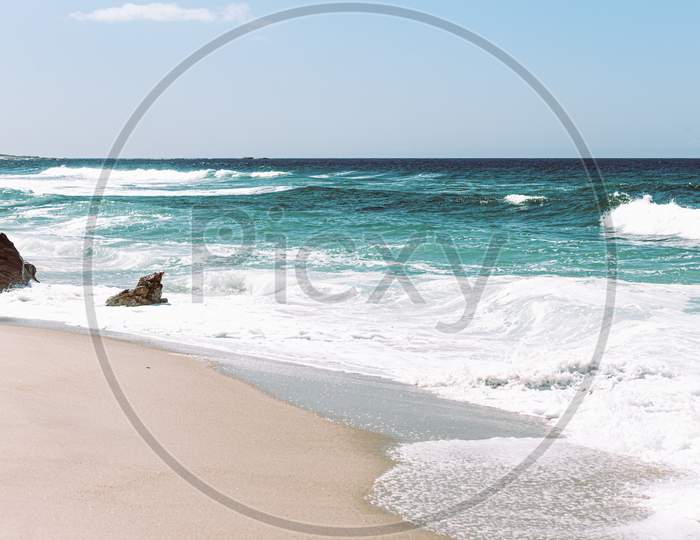 Bright And Relaxing Image Of A Wild Beach During A Sunny Day
