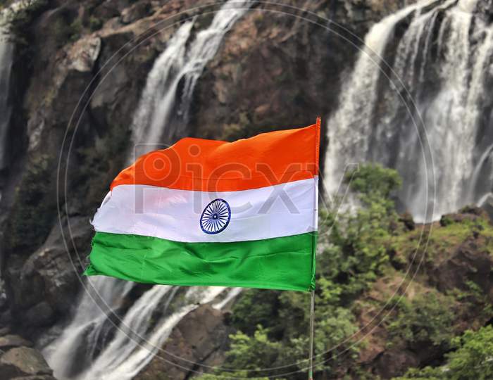 Indian flag with beautiful waterfalls in the background