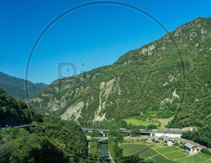 Italy, Train From Bolzano To Venice, A Close Up Of A Hillside Next To A Mountain
