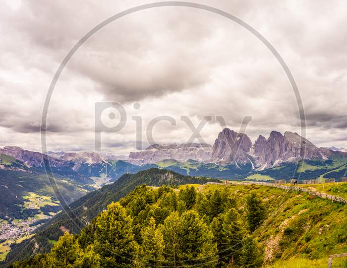 Alpe Di Siusi, Seiser Alm With Sassolungo Langkofel Dolomite, A Large Mountain In The Background