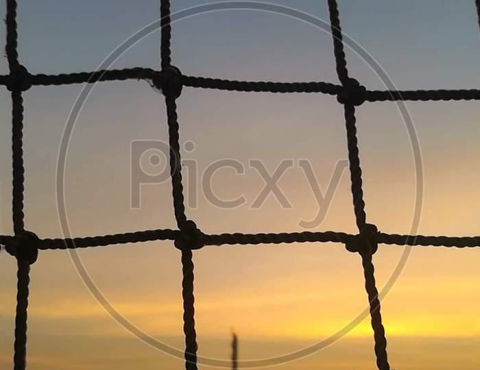 Sunset through net