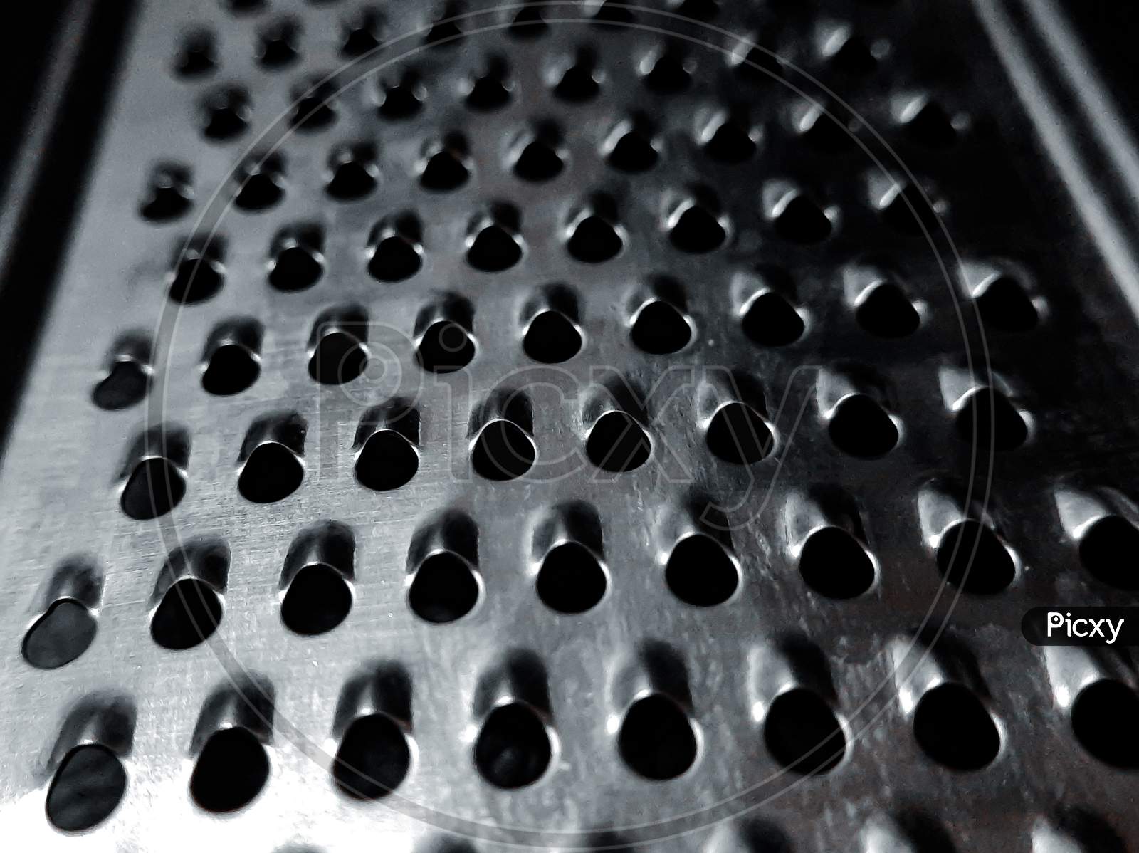 Chesse ginger grater macro photography.