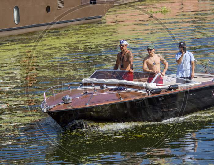 Gdansk, North Poland - August 15, 2020: Bunch Of Man Sailing A Motor Boat Over Motlawa River During Summer Time