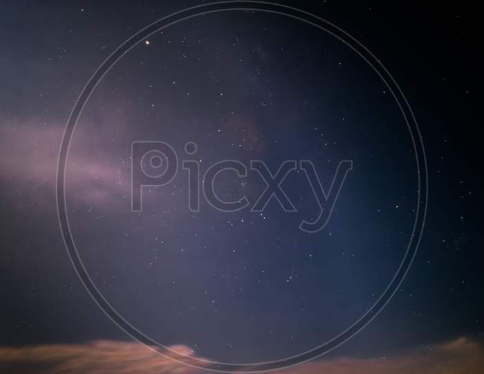 A Wallpaper Photo Of A Group Of Stars During A Full Moon And Some Fog In The Plain Sky.