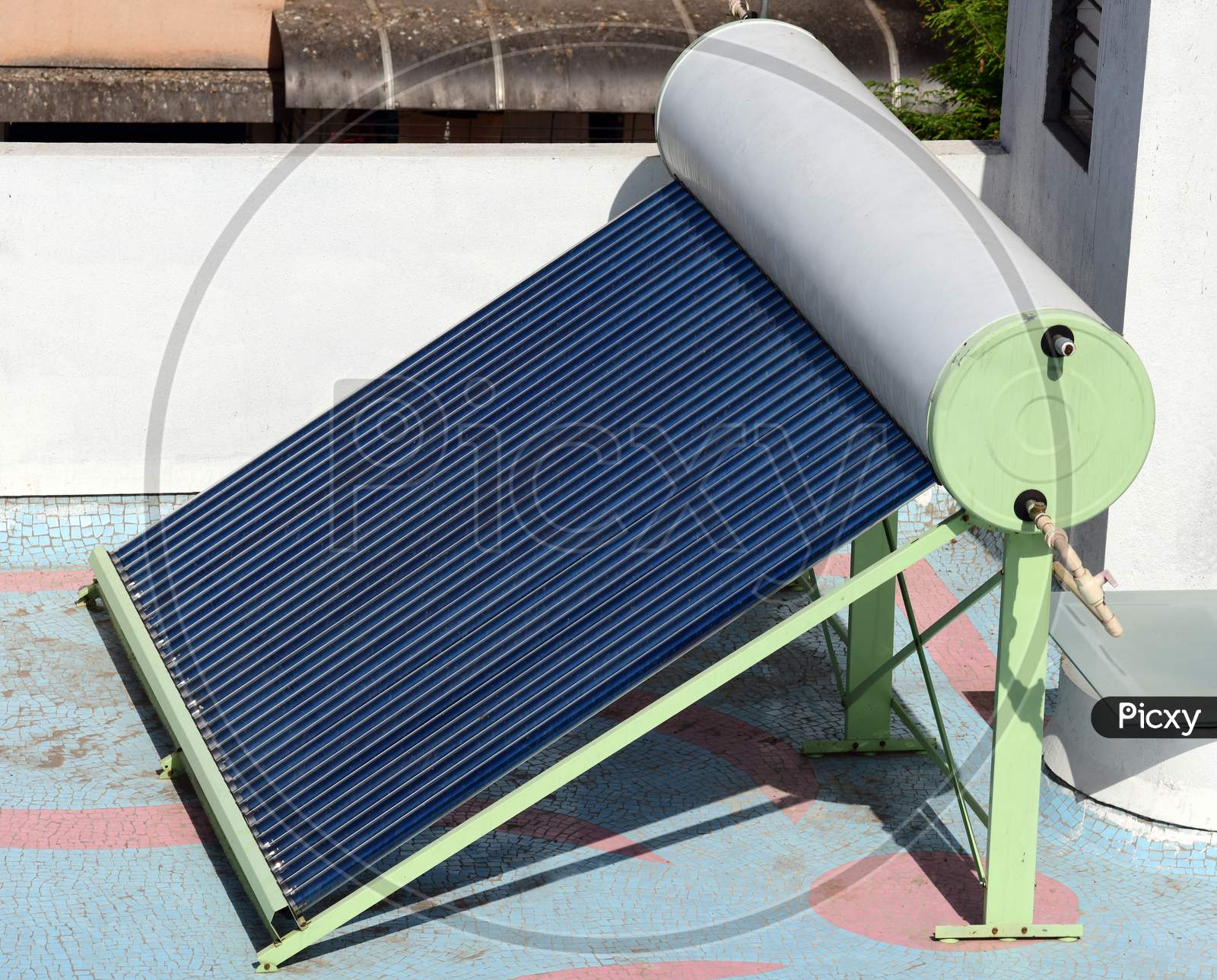 Solar Water Heater Unit Installed On The Terrace Of A Building